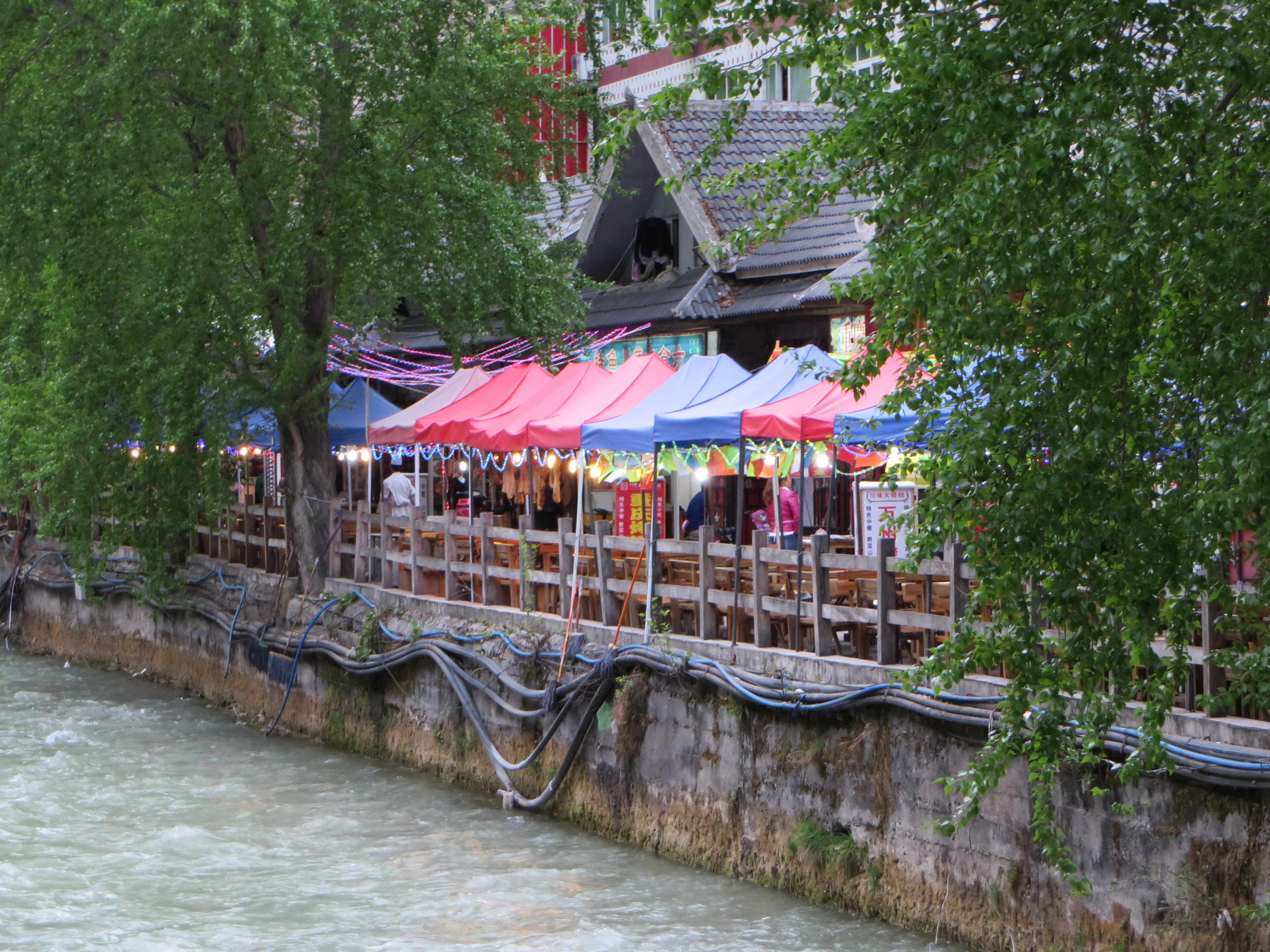 Near Park Entrance Dining<br/><br/>Along a river near the Jiuzhaigou Park entrance, there was a bunc